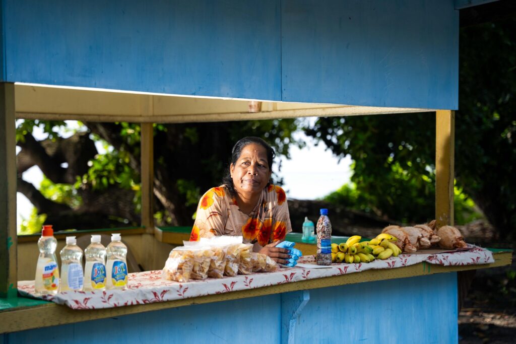Bellenina Bokna spends many days selling food, either near her home in Laura or in town at the organized farmers market. The money she earns helps her family make ends meet when her husband’s salary has been spent. Credit: Chewy Lin/Civil Beat