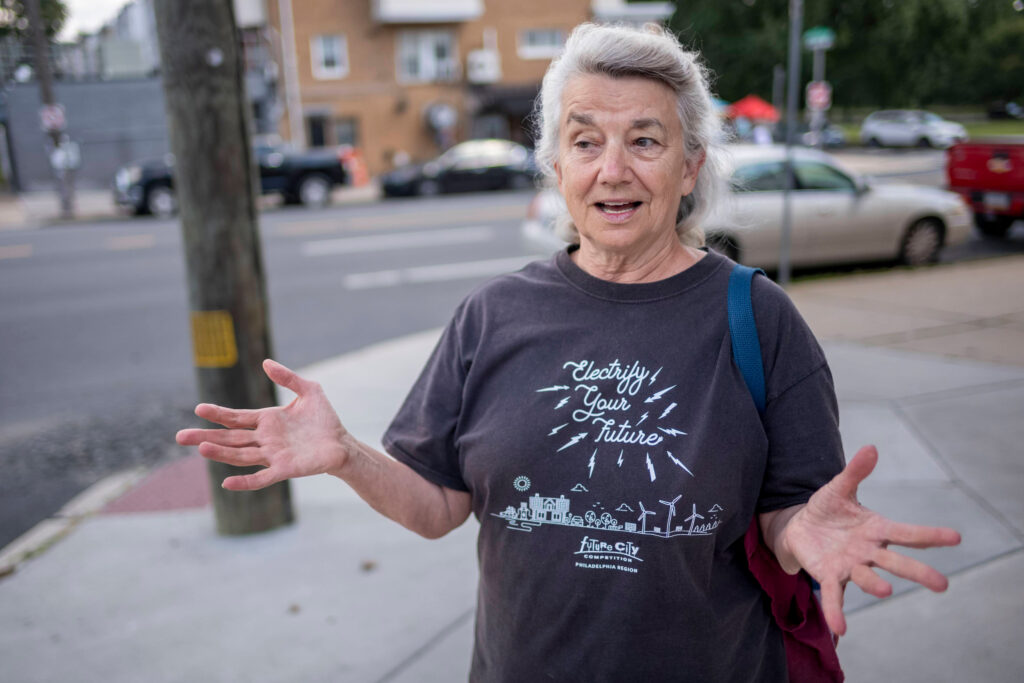 Liz Robinson at her solar-powered rental property in Philadelphia. Credit: Laurence Kesterson/Inside Climate News