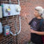 Liz Robinson, executive director at Philadelphia Solar Energy Association, at her solar-powered rental property in Philadelphia on Sept. 3. Credit: Laurence Kesterson/Inside Climate News