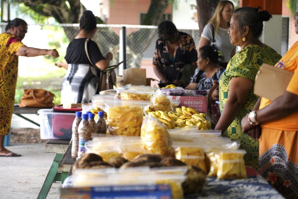 They set up shop near the Marshall Islands Resort on an almost-daily basis. Their products are all traditional, considered Marshallese comfort food and a special treat for city dwellers. Credit: Thomas Heaton/Civil Beat
