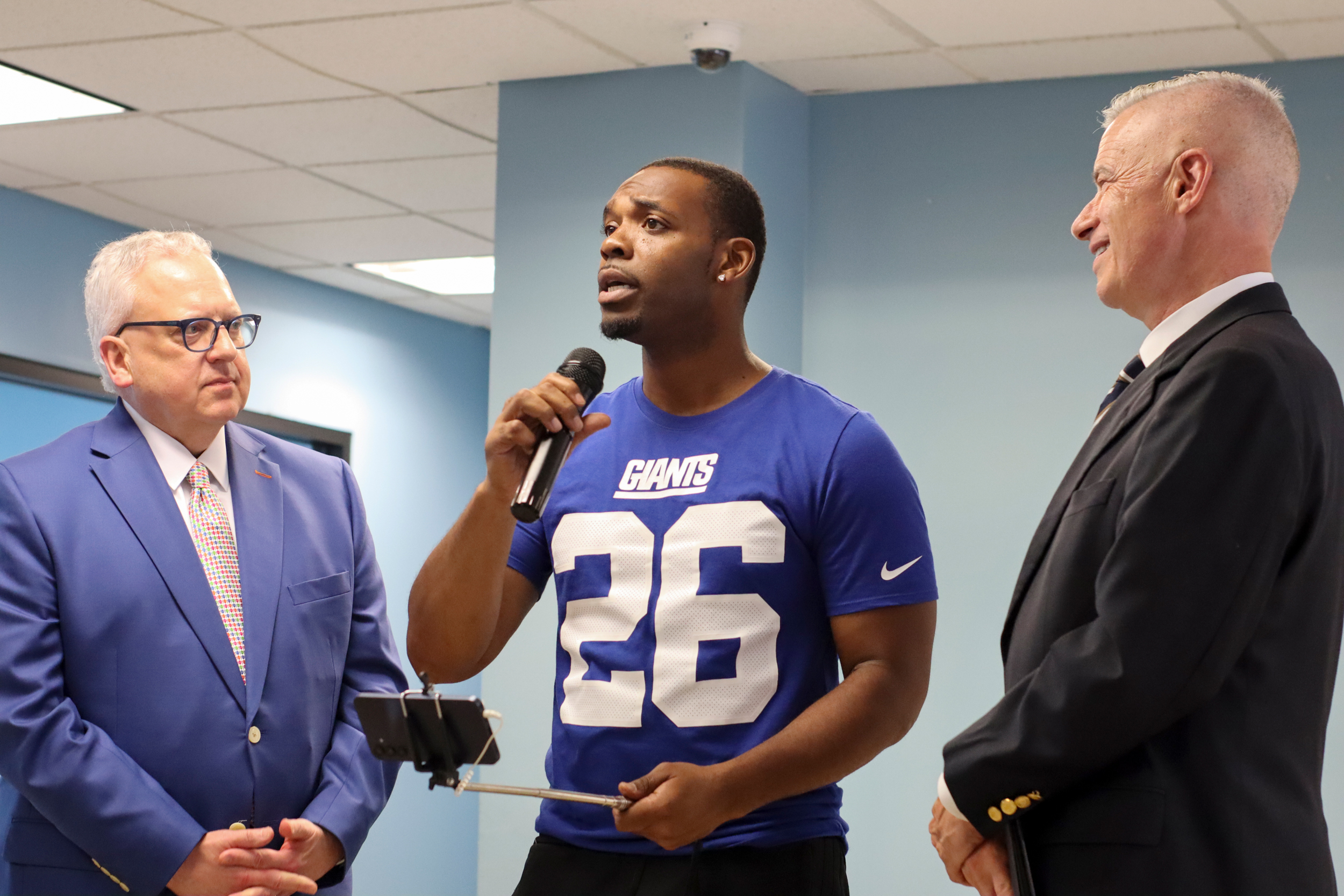 Kavone Little gives a speech to his fellow participants in the New Jersey Reentry Corporation solar panel installation seminar graduation day in Kearny, N.J. Credit: Rambo Talabong/Inside Climate News