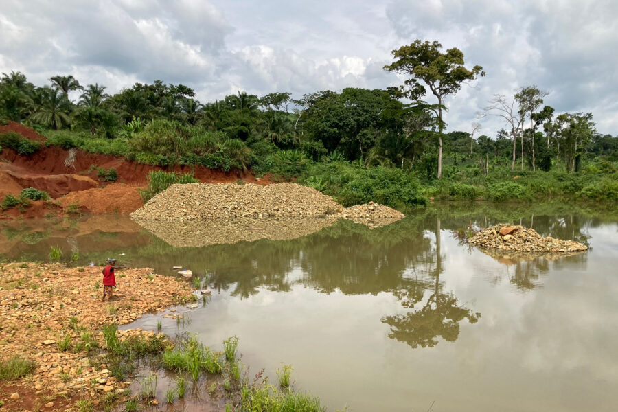 Near Moku, Haut-Uélé province in the Democratic Republic of the Congo, an Indigenous Mbuti woman points to a flooded, abandoned mine where her young relative drowned. Credit: Courtesy of PAX