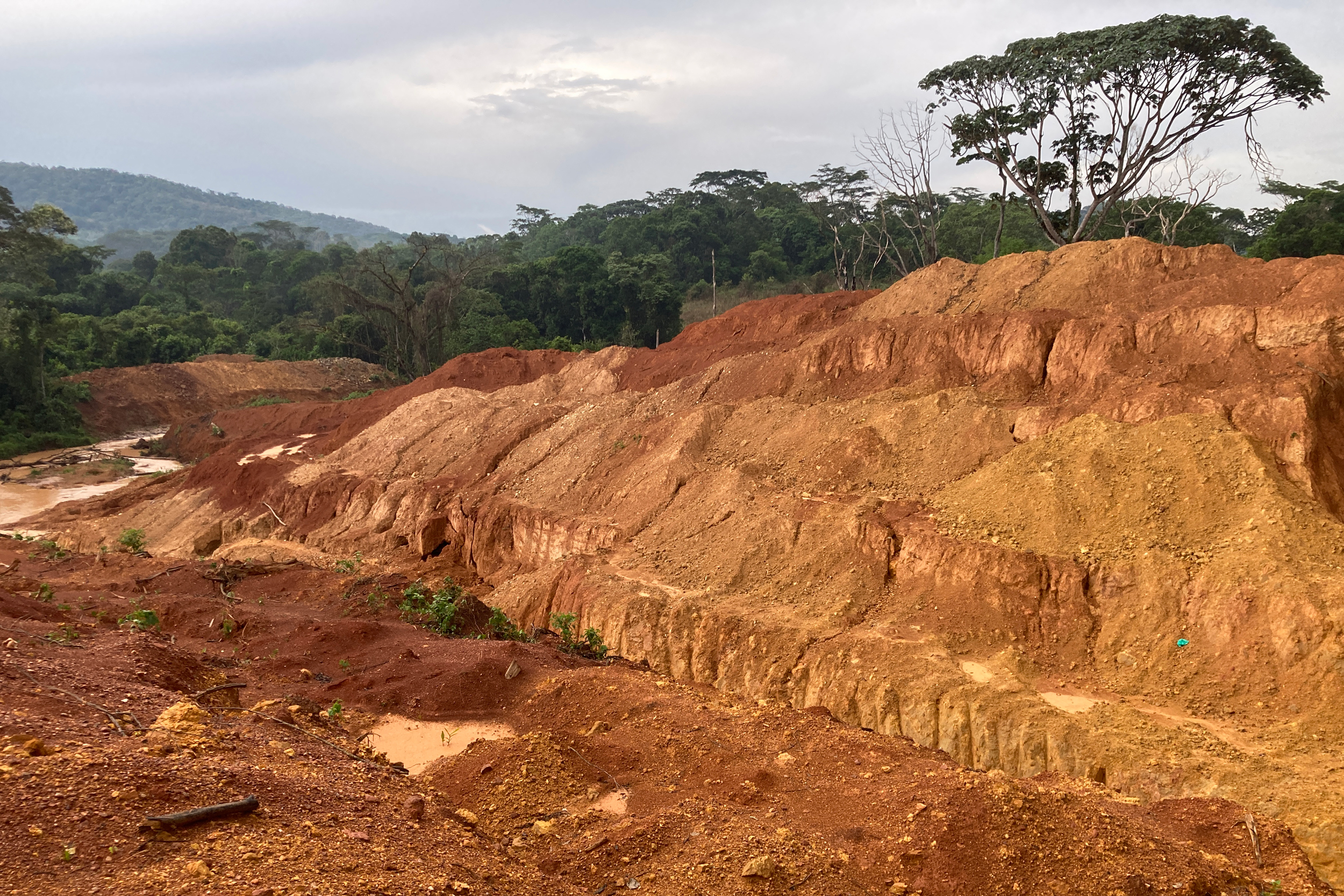 A former field near Moku, Haut-Uélé province, has been converted into a mining site, with a small river that once flowed through it. Credit: Courtesy of PAX