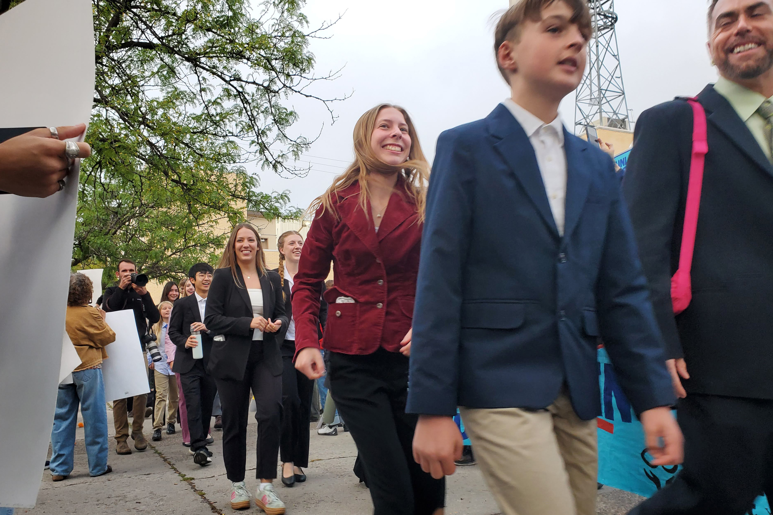 Eva Lighthiser (center) is the lead plaintiff in a case arguing that some of President Trump’s executive orders violate the Constitutional rights of youth. Credit: Elisabeth Kwak-Hefferan
