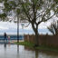 People walk along the shoreline of the Chesapeake Bay following heavy rain and flooding in North Beach, Md., on Aug. 9, 2024. Credit: Tom Brenner/The Washington Post via Getty Images