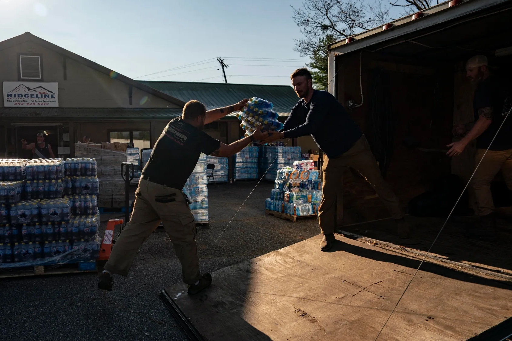 Volunteers load supplies for those impacted by Hurricane Helene in Bills Creek, N.C., on Oct. 3, 2024. Allison Joyce/AFP via Getty Images/Grist