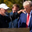 Donald Trump is prayed over by a local business owner in Swannanoa, N.C., during a visit to see the devastation of Hurricane Helene on Oct. 21, 2024. Credit: The Washington Post via Getty Images/Grist