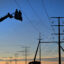 Working from the bucket of a boom truck linemen finish up work on large transmission structures that are part of an Xcel Energy project just south of Brush, Colo., on Jan. 8, 2024. Credit: Helen H. Richardson/MediaNews Group/The Denver Post via Getty Images