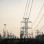 Transmission lines lead to an oil refinery in Deer Park, Texas. Credit: Ronaldo Schemidt/AFP via Getty Images