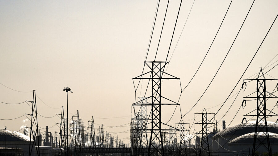Transmission lines lead to an oil refinery in Deer Park, Texas. Credit: Ronaldo Schemidt/AFP via Getty Images