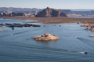 Boaters cruise across Lake Powell in Glen Canyon National Recreation Area on July 10 in Page, Ariz. Credit: Rebecca Noble/Getty Images
