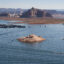 Boaters cruise across Lake Powell in Glen Canyon National Recreation Area on July 10 in Page, Ariz. Credit: Rebecca Noble/Getty Images