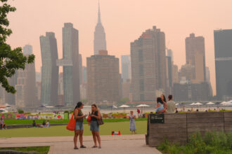 A thick haze blankets New York City as smoke from Canadian wildfires impacts air quality on August 5. Credit: Selcuk Acar/Anadolu via Getty Images
