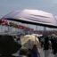 People shield themselves from the sun during a heat wave on Aug. 27 in Osaka, Japan. As deadly heat waves kill tens of thousands worldwide annually, the United Nations Environmental Programme has started controversial discussions about concepts to build an atmospheric umbrella for the Earth. Credit: Buddhika Weerasinghe/Getty Images