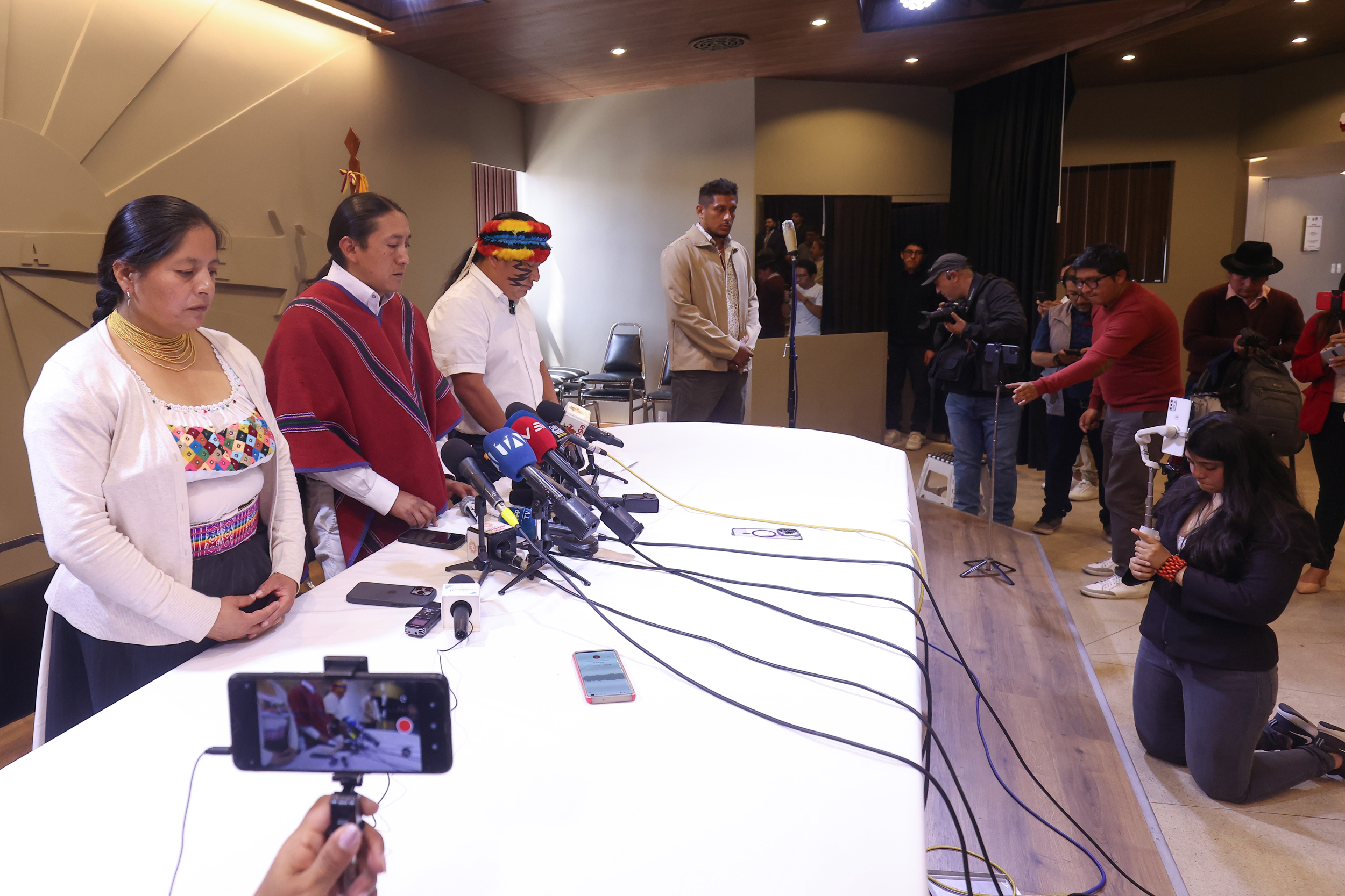 Members of CONAIE observe a moment of silence honoring Efraín Fueres on Monday in Quito, Ecuador. Credit: Franklin Jacome/Agencia Press South via Getty Images