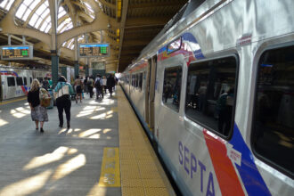 Commuters board a SEPTA train in Philadelphia. Credit: Gregory Adams/Getty Images