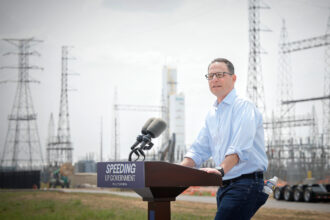 Pennsylvania Gov. Josh Shapiro speaks in front of the Keystone Trade Center during a press conference on Aug. 7 in Falls Township, Pa.