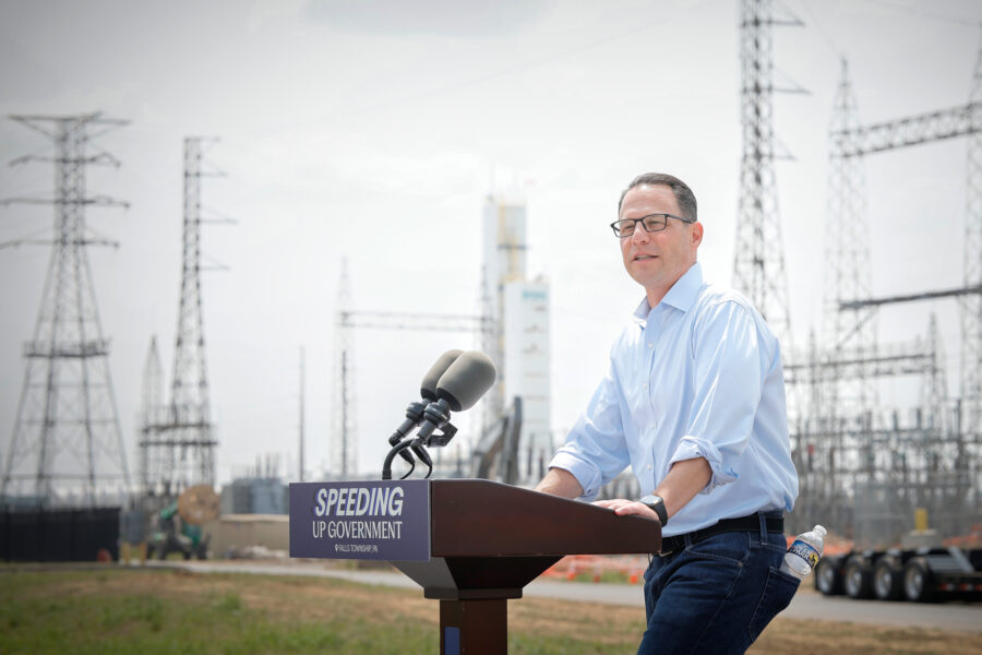 Pennsylvania Gov. Josh Shapiro speaks in front of the Keystone Trade Center during a press conference on Aug. 7 in Falls Township, Pa.