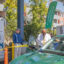 Glad Tidings’ founder, Bishop Jerry Macklin and one of the church’s new EV charging stations. Credit: Courtesy of Glad Tidings
