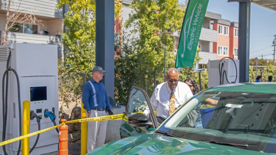 Glad Tidings’ founder, Bishop Jerry Macklin and one of the church’s new EV charging stations. Credit: Courtesy of Glad Tidings