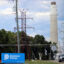 Transmission lines stand in front of Dominion Energy’s Chesterfield Power Station in Chesterfield, Va. Credit: Charles Paullin/Inside Climate News