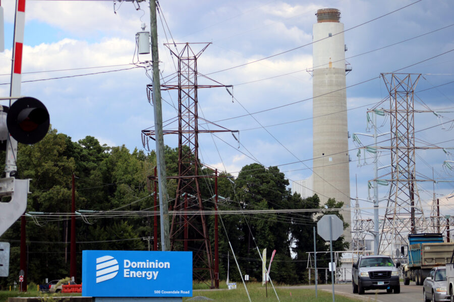 Transmission lines stand in front of Dominion Energy’s Chesterfield Power Station in Chesterfield, Va. Credit: Charles Paullin/Inside Climate News