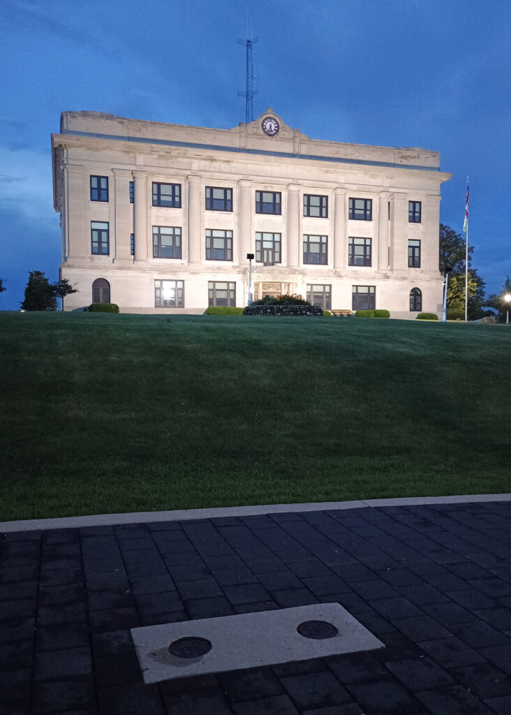 Buried beneath the front lawn of the county courthouse, 132 boreholes, each of which are 300 feet deep, work as a thermal equalizer providing steady 50-degree temperatures for the heating and cooling system. Credit: Phil McKenna/Inside Climate News