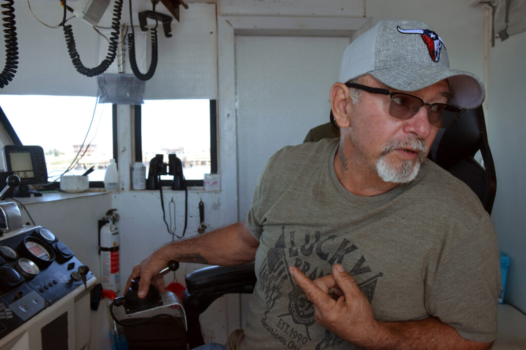 Ray Mallet, aboard his boat Cajun Memories on the Calcasieu River near Cameron, La. Credit: Phil McKenna/Inside Climate News
