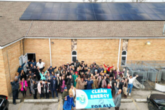 New Mount Hermon Missionary Baptist Church members celebrate the installation of rooftop solar panels in southwest Detroit. Credit: Courtesy of Michigan Interfaith Power & Light