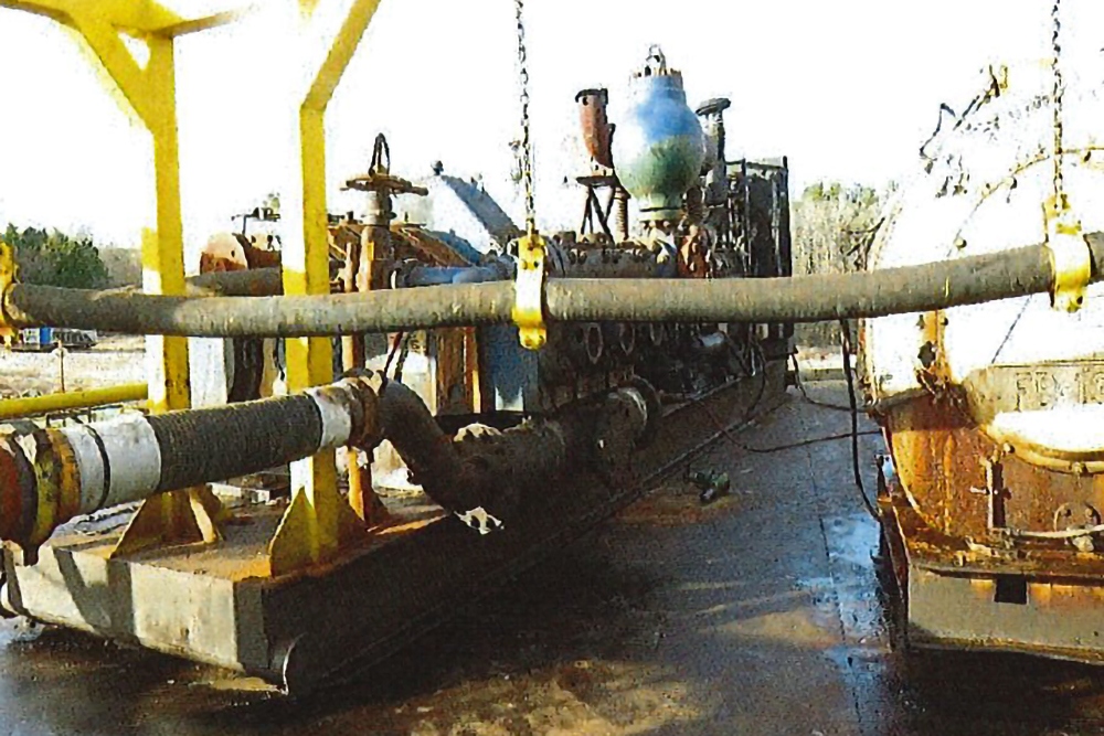 A photograph from the OSHA investigation report shows the location where Pedro Julian Garcia was fatally struck by a valve at McBride Operating in Waskom, Texas. The valve which lies on the ground next to the pump. Credit: OSHA