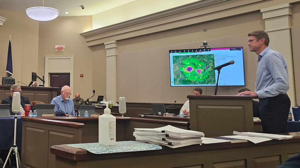 Jarrod Pitts, senior director of project development at Tenaska Energy, stands at the podium before the Fluvanna County Planning Commission. Credit: Charles Paullin/Inside Climate News