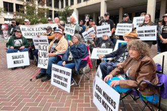 Coal miners and their advocates gather outside the U.S. Department of Labor headquarters in Washington, D.C., protesting the Trump administration’s delay of rules limiting silica dust exposure for mine workers. Credit: Aidan Hughes/Inside Climate News