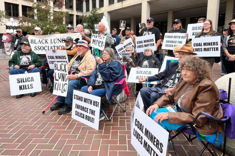 Coal miners and their advocates gather outside the U.S. Department of Labor headquarters in Washington, D.C., protesting the Trump administration’s delay of rules limiting silica dust exposure for mine workers. Credit: Aidan Hughes/Inside Climate News