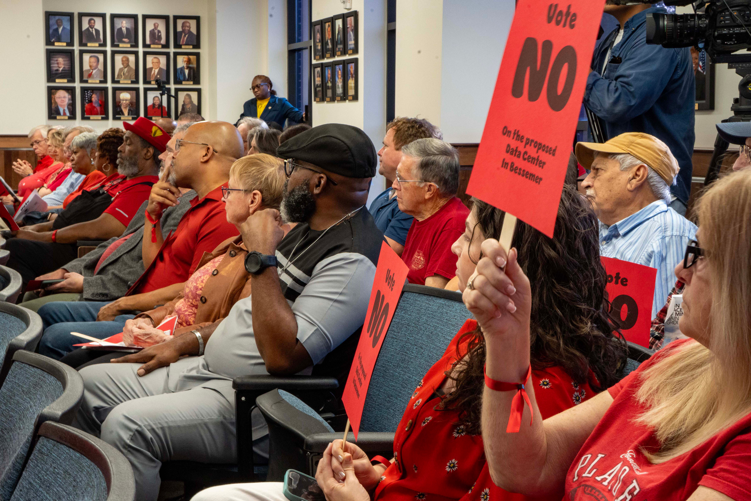 Bessemer residents dress in red to show their opposition to Project Marvel during a City Council meeting in August 2025. Credit: Lee Hedgepeth/Inside Climate News
