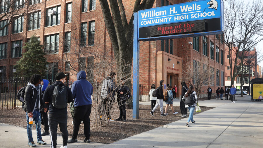 Students gather outside Wells Community Academy High School at the end of the school day on March 14, 2022, in Chicago. Credit: Scott Olson/Getty Images