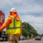 A construction worker ushers traffic on July 11, 2023, during a record-setting heat wave in Austin, Texas. Credit: Brandon Bell/Getty Images
