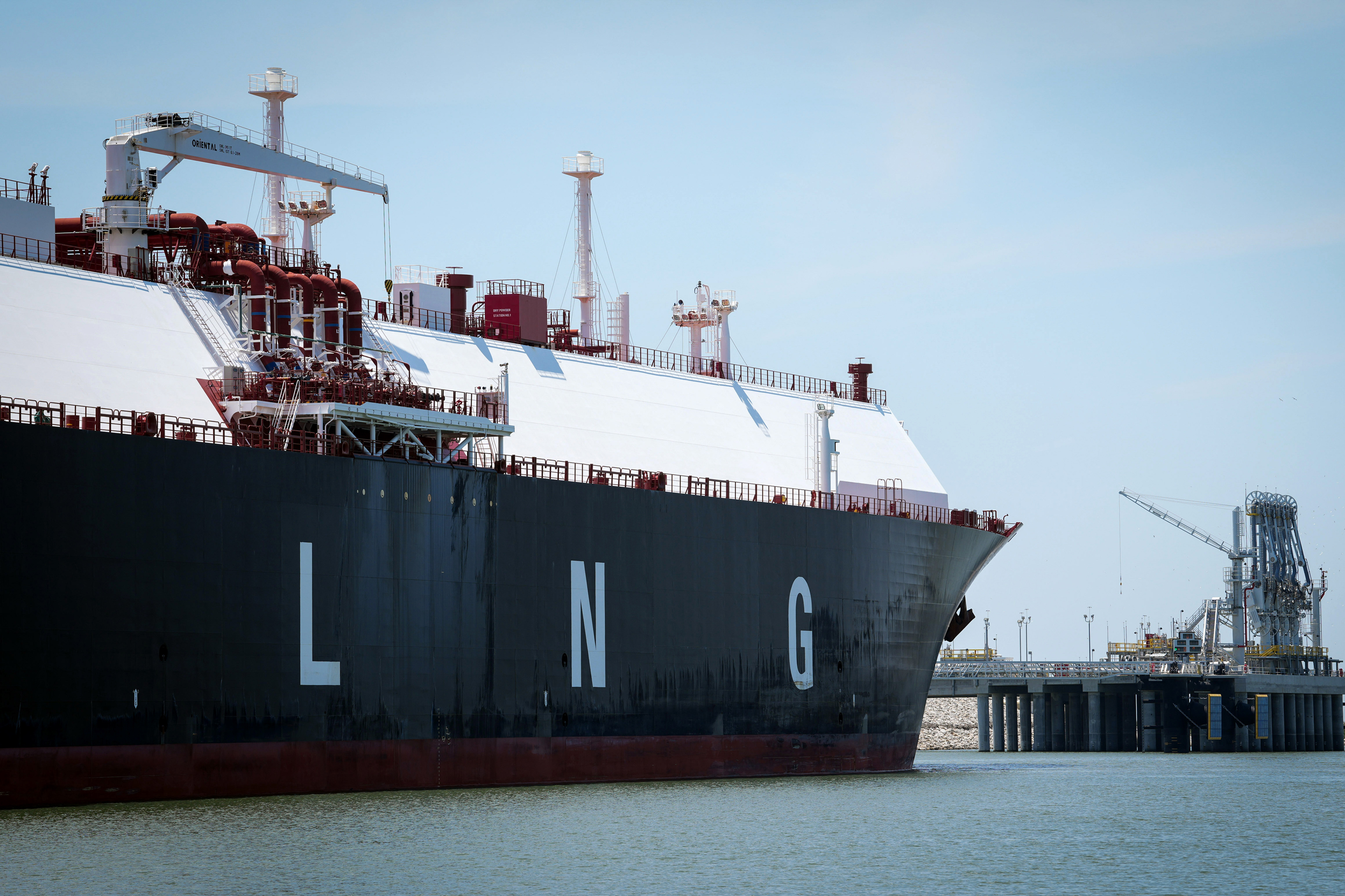 A liquefied natural gas carrier ship sits docked in the Calcasieu River near Cameron, La. Credit: Jon Shapley/Houston Chronicle via Getty Images