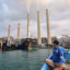 A fisherman observes the coal-fired Suralaya Power Station in Banten Province, Indonesia, on Oct. 31, 2023. Credit: Ronald Siagian/AFP via Getty Images