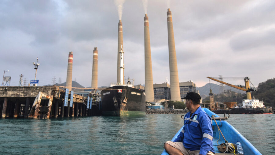 A fisherman observes the coal-fired Suralaya Power Station in Banten Province, Indonesia, on Oct. 31, 2023. Credit: Ronald Siagian/AFP via Getty Images