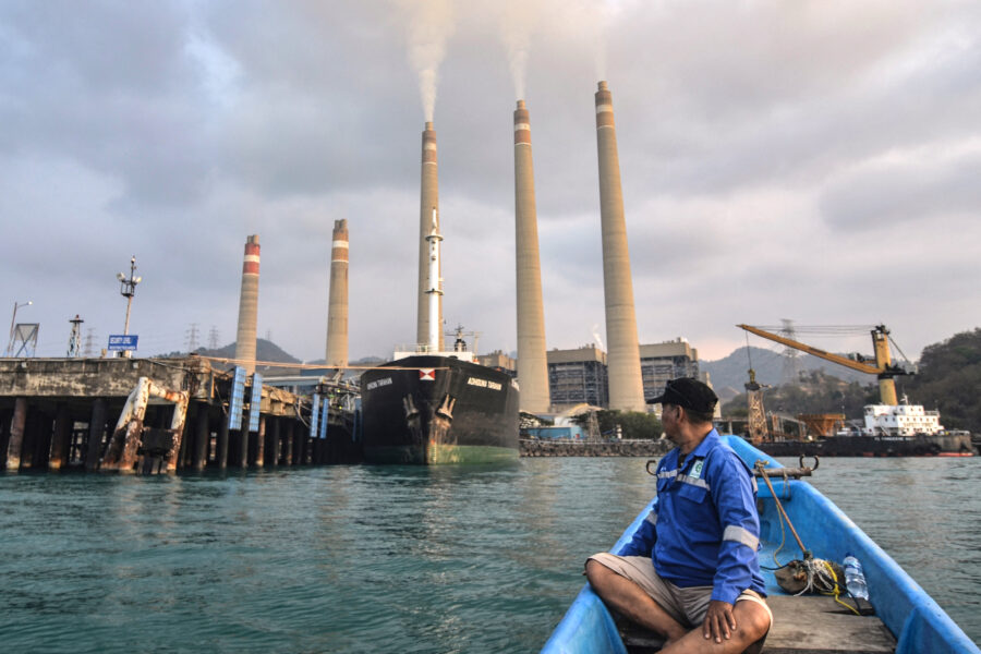 A fisherman observes the coal-fired Suralaya Power Station in Banten Province, Indonesia, on Oct. 31, 2023. Credit: Ronald Siagian/AFP via Getty Images