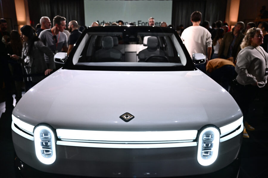 People attend the launch event for the Rivian R2 at the Rivian South Coast Theater in Laguna Beach, Calif., on March 7, 2024. Credit: Patrick T. Fallon/AFP via Getty Images