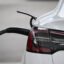 EV batteries connected to chargers are a potentially vast resource that could be utilized by the grid. Credit: Patrick T. Fallon/AFP via Getty Images