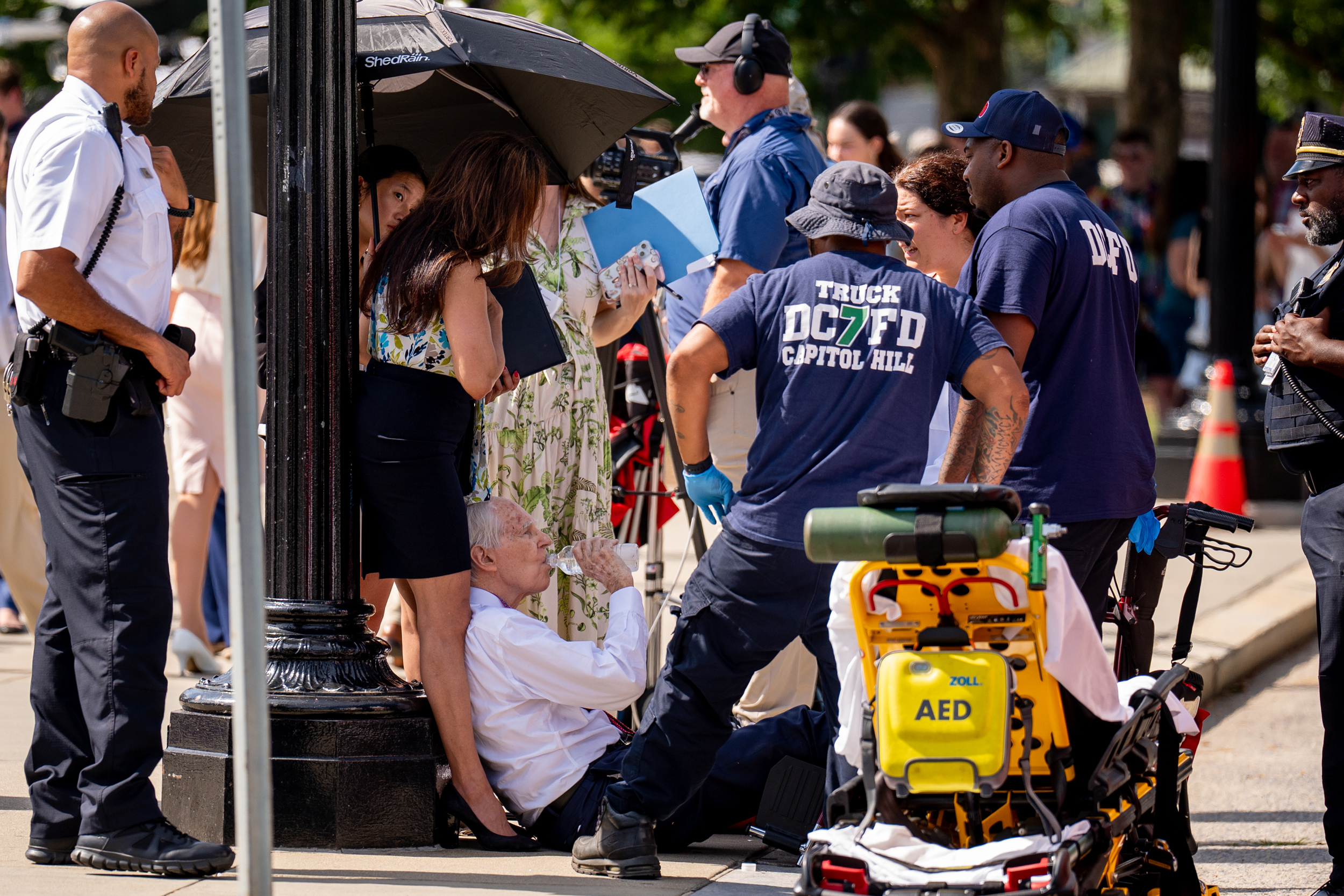 A man is attended to after fainting in the heat outside the Supreme Court on June 20, 2024, in Washington, D.C. Credit: Andrew Harnik/Getty Images