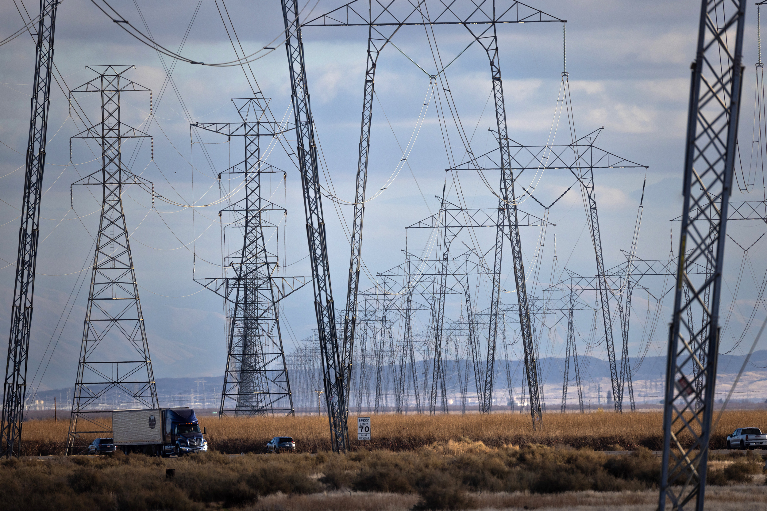 High-voltage transmission lines run along Interstate 5 in the central California community of Buttonwillow. Credit: Jay L. Clendenin/Getty Images