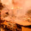 A man views his property as it burns during the Eaton Fire in the Altadena area of Los Angeles County on Jan. 8. Credit: Josh Edelson/AFP via Getty Images