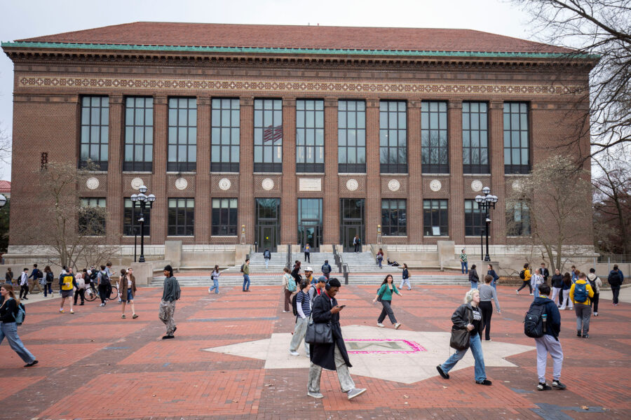 Students walk through the University of Michigan campus on April 3 in Ann Arbor, Mich. Credit: Bill Pugliano/Getty Images