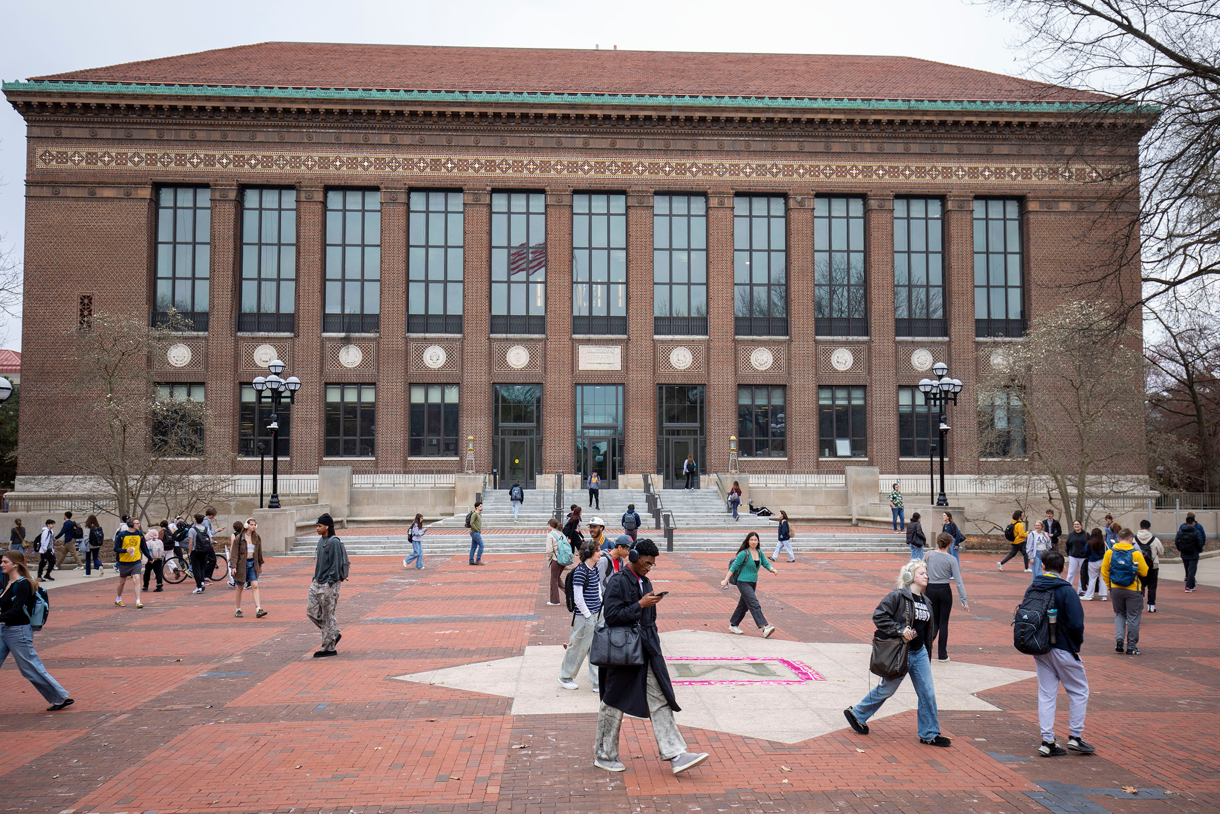 Students walk through the University of Michigan campus on April 3 in Ann Arbor, Mich. Credit: Bill Pugliano/Getty Images