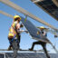 Workers install solar panels at the Ningguoyun Lingwu 1 million kilowatt photovoltaic project in the desert of China’s northern Ningxia region on April 14. Credit: STR/AFP via Getty Images