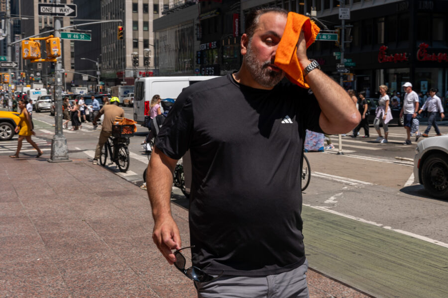 People try to stay cool on the sweltering streets of Manhattan as New York City experiences a heat wave on July 29. Credit: Spencer Platt/Getty Images