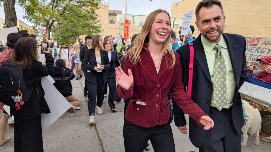 Eva Lighthiser (center), lead plaintiff in the Lighthiser v. Trump case, walks with attorney Mat dos Santos as they arrive at the Russell Smith Courthouse in Missoula, Montana, on Sept. 16. Credit: Issam Ahmed/AFP via Getty Images